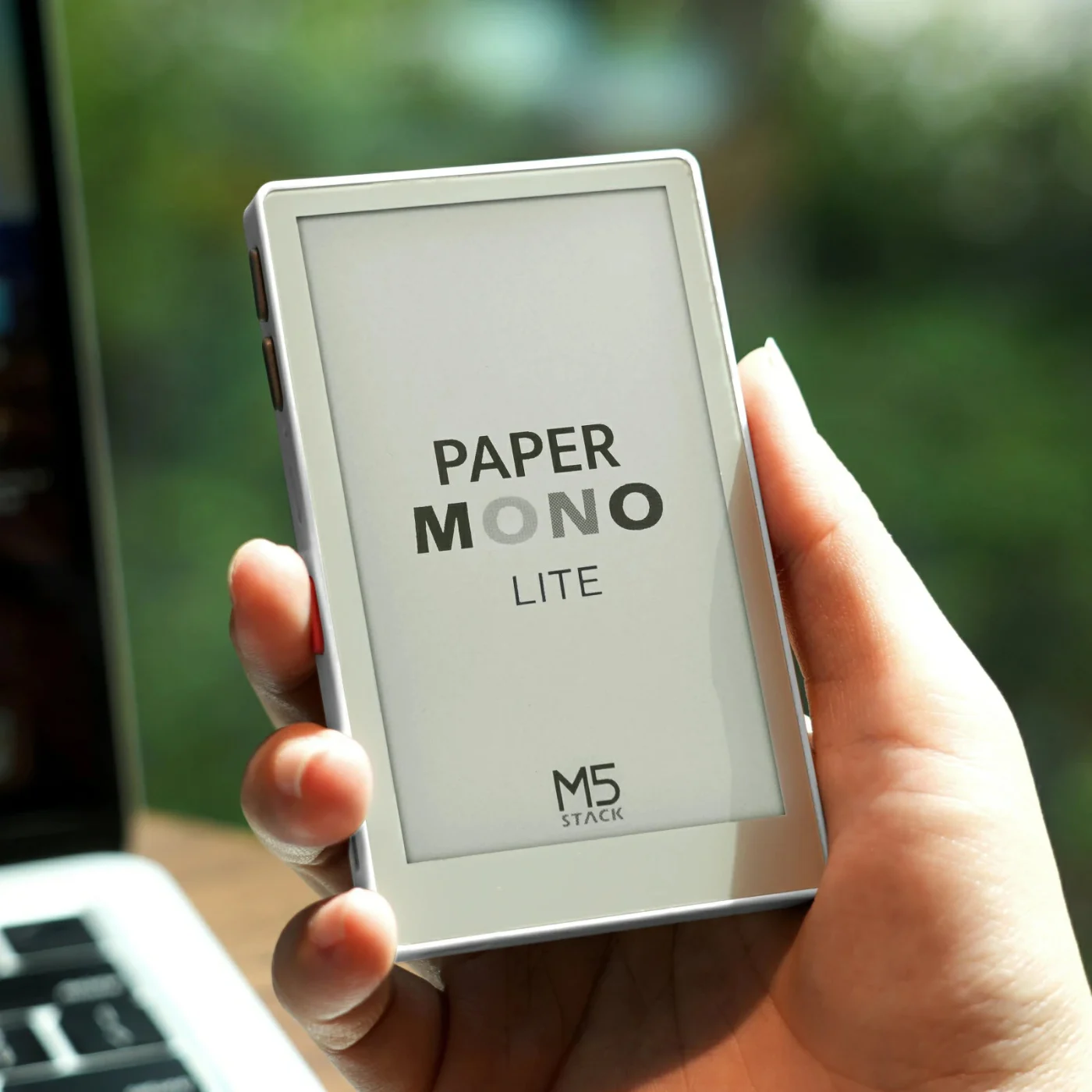 PaperMono Lite touch e-paper development kit held in one hand