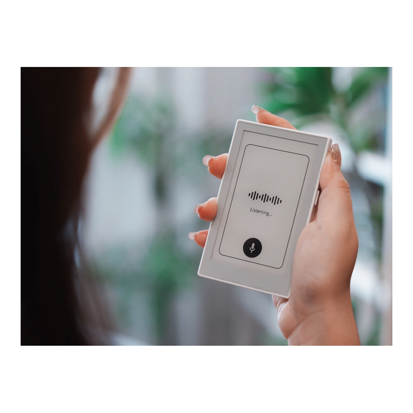 Person holding reTerminal Sticky while recording a voice note