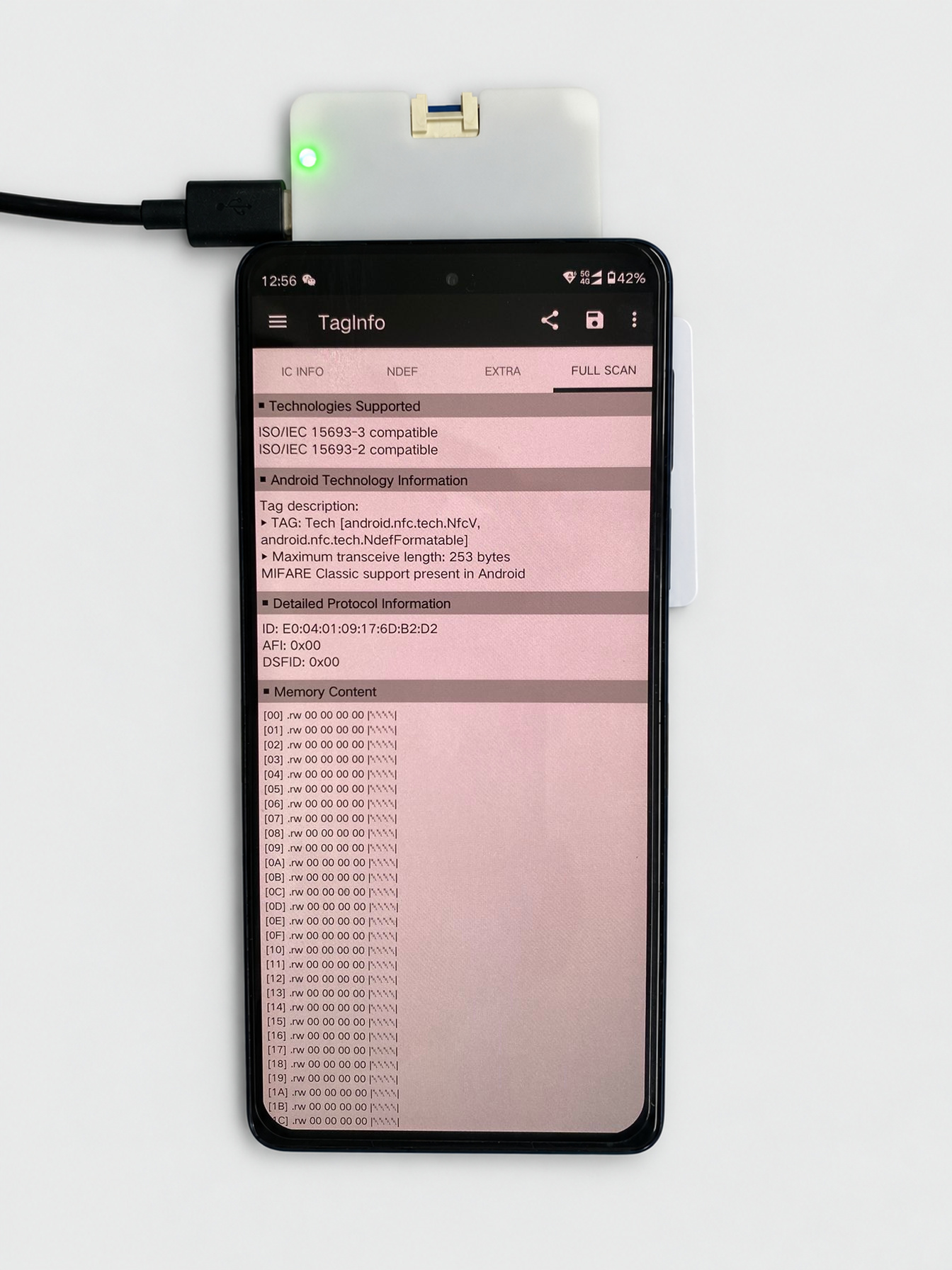Reading the physical card with TagInfo while capturing the exchange.